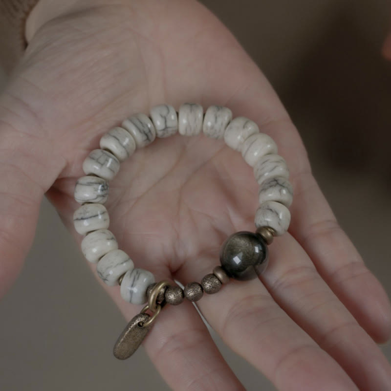 Karma Stone Tibetan Yak Bone Gold Sheen Obsidian Brass Bead Strength Bracelet